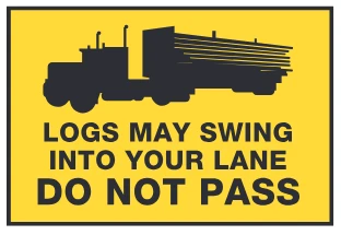 Logs may swing into your lane – do not pass sign from the Driver’s Guide