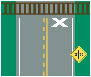 X pavement marking before a railway crossing